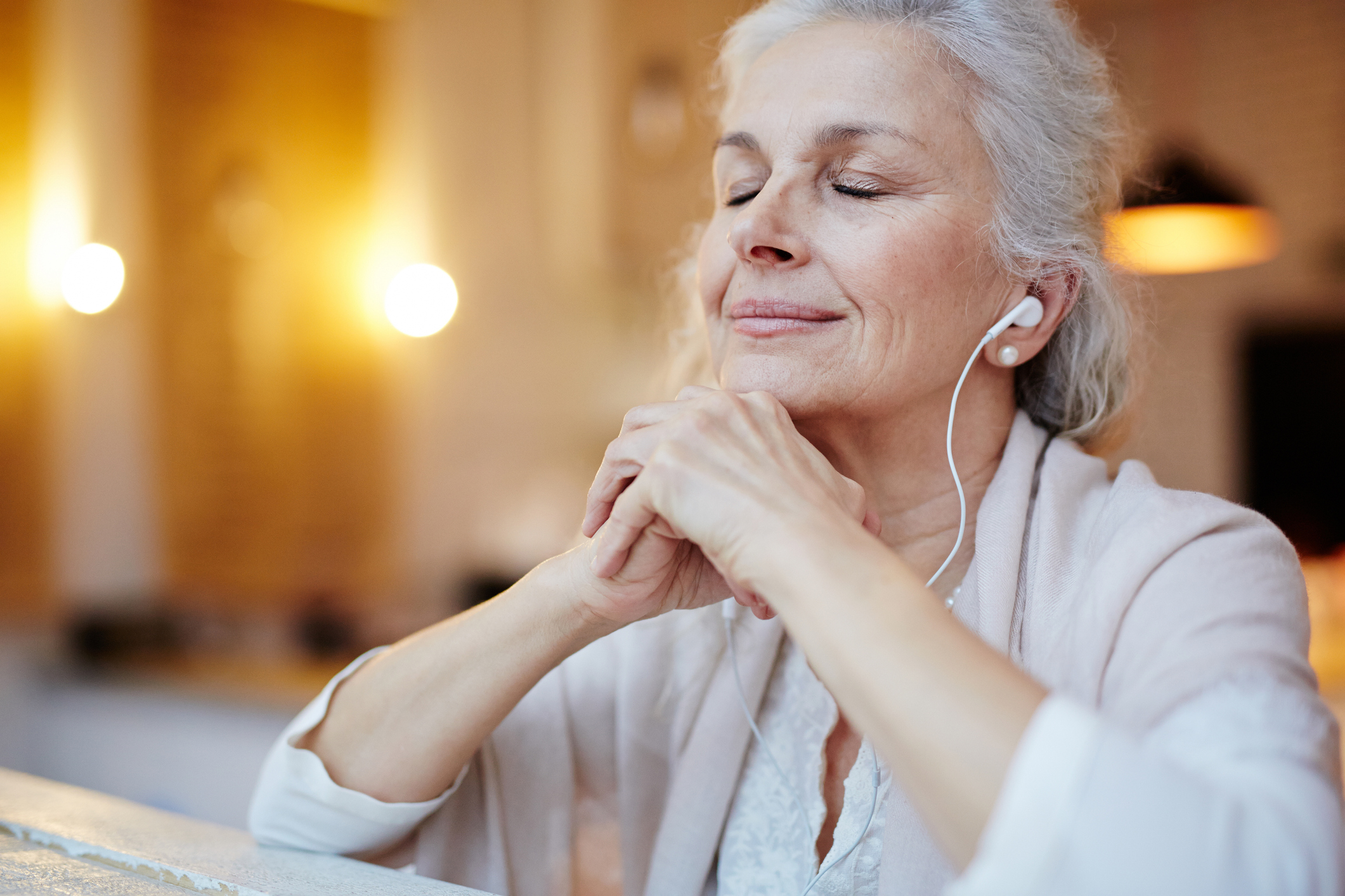 Senior woman shows how music can help with mental health